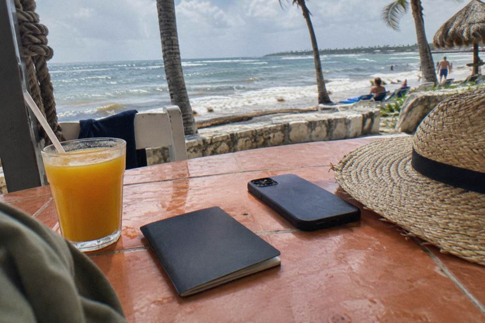 Passport pages and a printed QR code resting on a bright tiled table