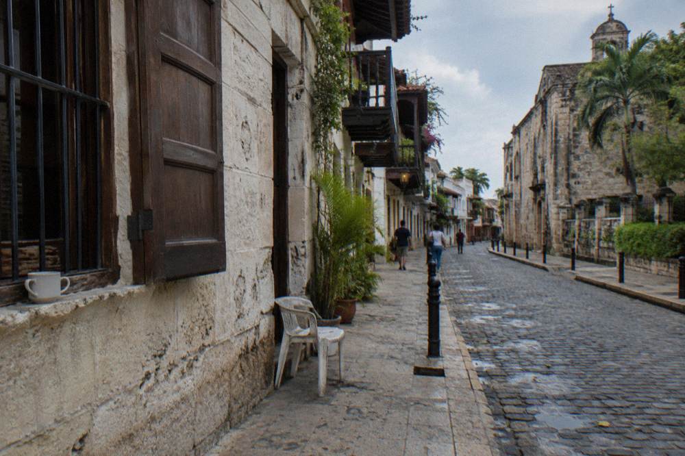 Colonial stone buildings along a quiet historic street in Santo Domingo